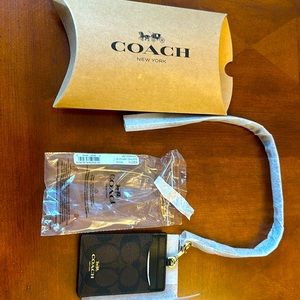 Tag ID/Cardholder. Brand new. Use it with the leather string/ neck or without.